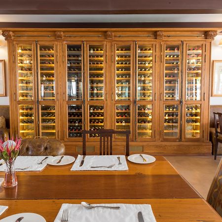 Drostdy Hotel Храфф-Рейнет Экстерьер фото Wine rack at the restaurant