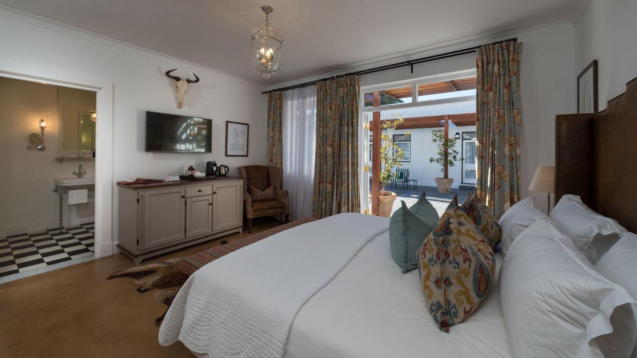 Drostdy Hotel Храфф-Рейнет Экстерьер фото A bedroom at the Cape Heritage
